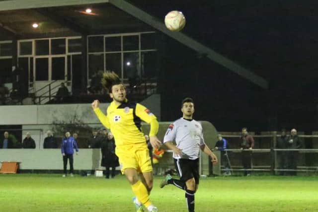 Billy Medlock scores Hastings United's goal against Molesey with a terrific header. Picture courtesy Scott White