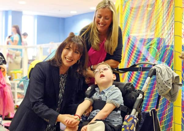DM1519922a.jpg Samantha Cameron launches new Hop, Skip and Jump Foundation Centre for disabled children in Swan Walk shopping centre, Horsham. Meeting Laura Moore and son William 6. Photo by Derek Martin SUS-150728-155220008