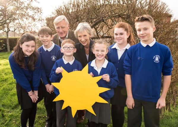 Louise Goldsmith, leader of West Sussex County Council, and Pieter Montyn, local member for The Witterings, with pupils from East Wittering Community Primary School