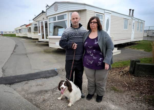 Steven Bramble and Lesley Taylor outside their caravan in Camber
