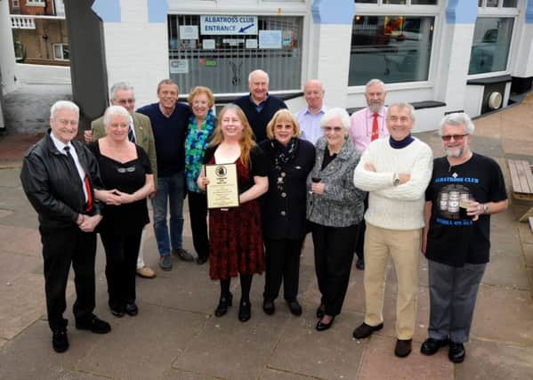 CAMRA present Club of the Year award to The Albatross Club, Bexhill.

Karen Pelham (Chief Steward) pictured with the club's committee. SUS-160326-115414001