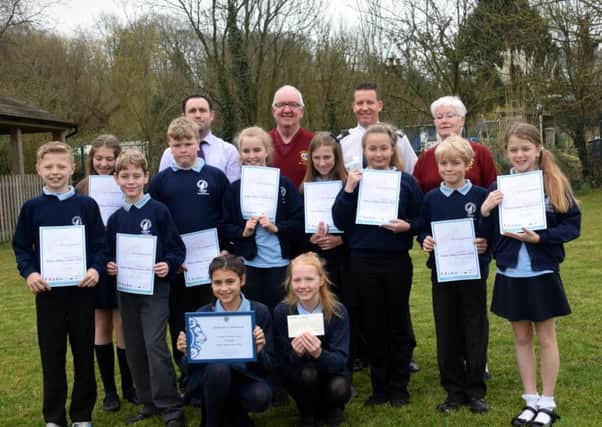 Catsfield CE Primary School pupils, Jonathan Elms Deputy Head, Lions Liz and Jim McGlynn and Andy Reynolds Director of Prevention and Protection SUS-160329-124642001