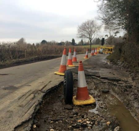 A massive pothole measuring 10ft long and more than a foot deep near Framfield, East Sussex. Photo by SWNS. SUS-160324-164711001