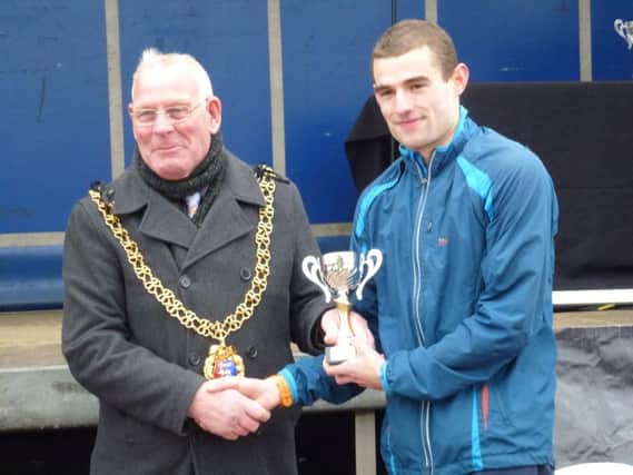 Rhys Boorman receives his third place trophy from Mayor of Hastings, Cllr Bruce Dowling (SUS-160320-142127002)