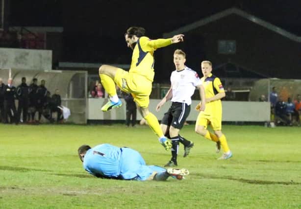 Action from Hastings United's 2-1 defeat at Molesey on Tuesday night. Picture courtesy Scott White