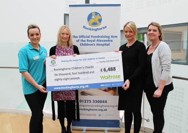 Rockinghorse recieves a cheque from Waitrose SUS-160330-150857001