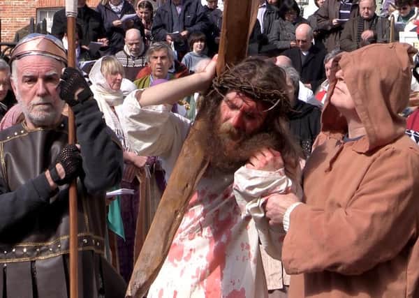 Re-enactment of Christ's crucifixion in Hastings Old Town. Photo taken from the video. SUS-160326-115458001