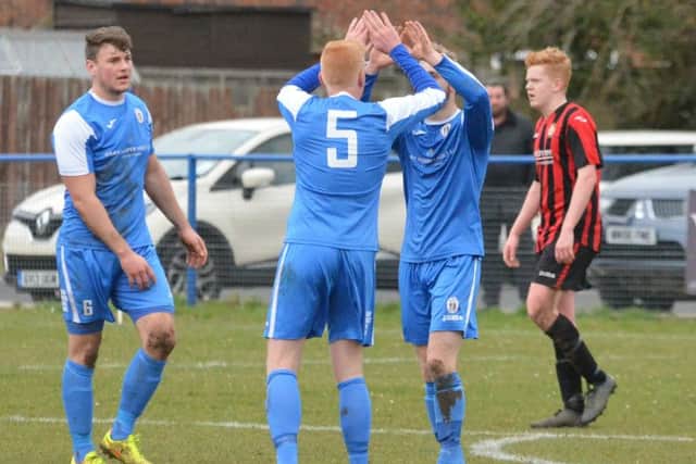 Max Miller gets congratulated on his goal. Picture by Grahame Lehkyj