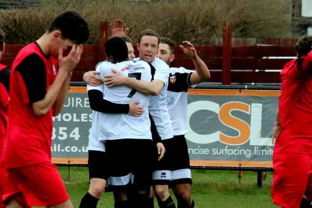 Pagham celebrate the vital goal against Hassocks / Picture by Roger Smith