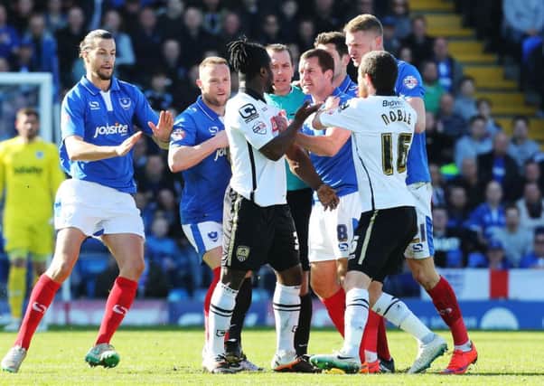 Pompey skipper Michael Doyle tussles with Notts Countys Stanley Aborah during the Good Friday win over the Magpies
