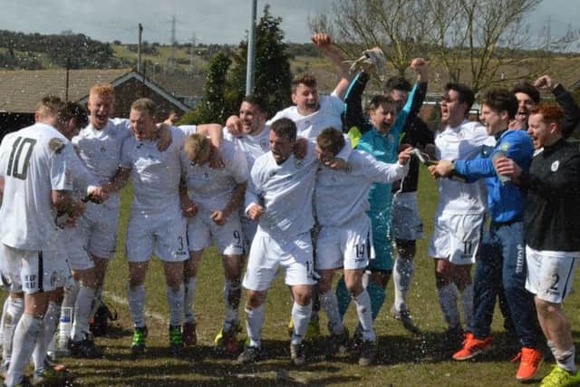 Haywards Heath Town players celebrate winning the league title at Mile Oak. Picture by Grahame Lehkyj