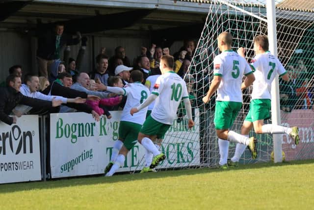 Bognor's player celebrate Jason Prior's late penalty winner over Burgess Hill / Picture by Tim Hale