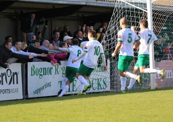 Bognor's player celebrate Jason Prior's late penalty winner over Burgess Hill / Picture by Tim Hale