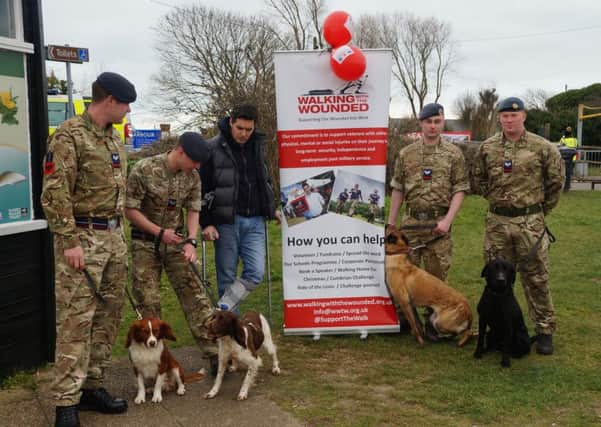 RAF sniffer dogs and their handlers with Huw Merriman MP at Rye Harbour Nature Reserve for the veteran's walk