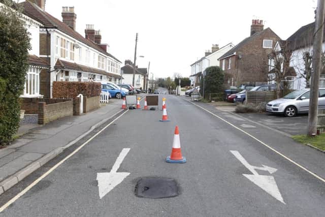 A sink hole opened up in Mill Road, Burgess Hill