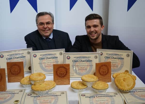 Philip Turner, left, with his son Philip Turner and some of their champion pies