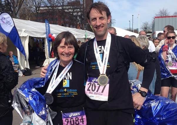 Jan Barnes and son Ben with the medals at the ASICS Greater Manchester Marathon on Sunday GNnvx_-H5eRWfhSGMnXX