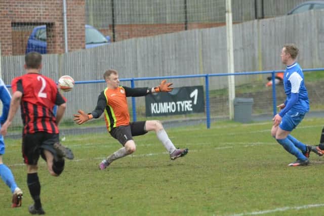Callum Saunders shoots past the keeper. Picture by Grahame Lehkyj SUS-160328-124102001