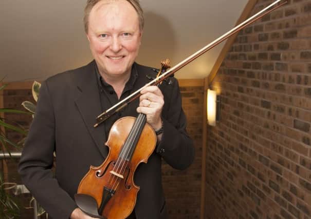 Andrew Bernardi and his 1696 Stradivarius