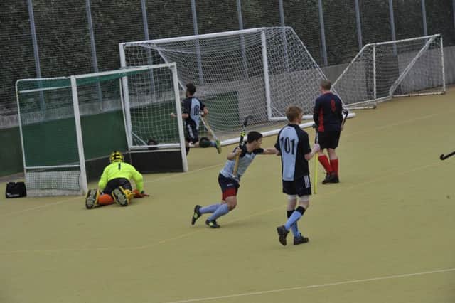 Olli Beal wheels away in celebration after scoring in South Saxons' last game against Brighton & Hove III. Picture by Simon Newstead (SUS-160321-175209002)