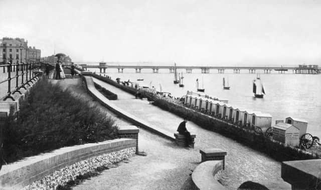 A photograph of the very first pier shows the structure stretching out to sea