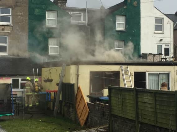 Firefighters tackle a roof fire in Littlehampton