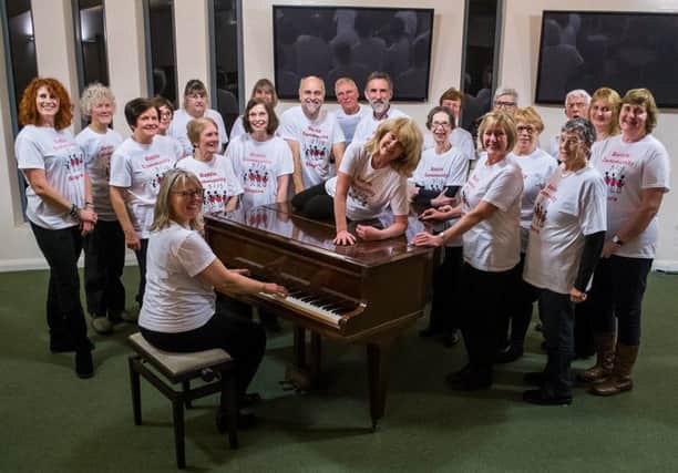 Battle Community Singers round the piano
