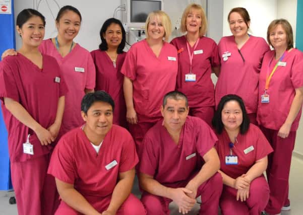 Sister Patti Sinnamon (back row, third from right) retiring from nursing at Surrey and Sussex Healthcare NHS Trust. Pictured with her team in the theatre recovery area - picture submitted by Surrey and Sussex Healthcare NHS Trust