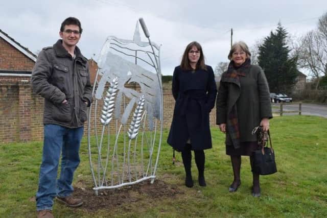 Alex Smith, Affinity Sutton development officer Clare Coxsell and Tricia Tull with the wheat panel