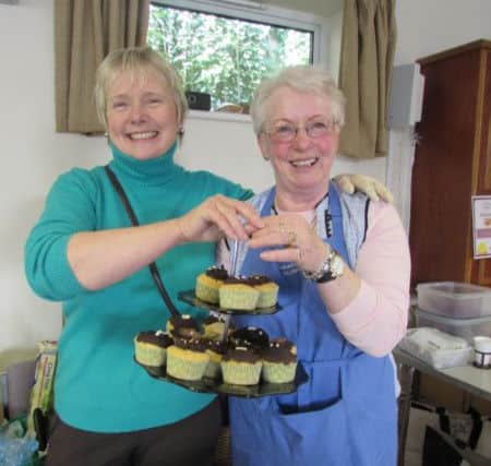 Barbara Simmonds and Liz Francisco with fabulous chocolat cup cakes SUS-160604-130117001