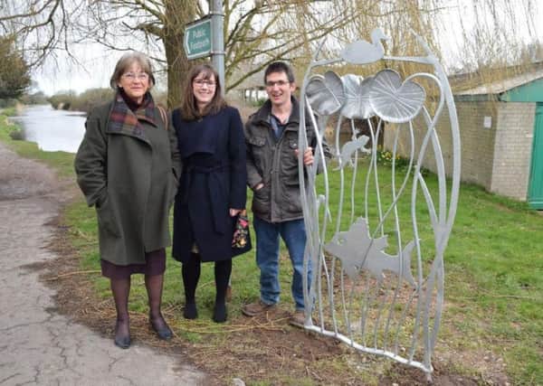 Blacksmith Alex Smith, Chichester councillor Tricia Tull, left, and Affinity Sutton development officer Clare Coxsell with the lily panel