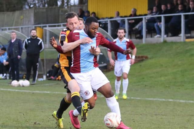 Kevant Serbony holds off an East Grinstead Town opponent. Picture courtesy Scott White