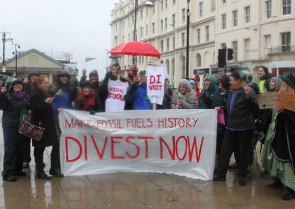 Residents campaigning for fossil fuel divestment in Hastings town centre