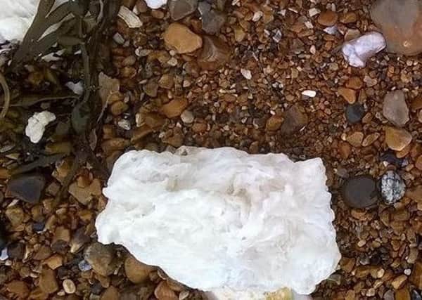 Palm Oil washed up on the beach. Photo by Karen Hardy