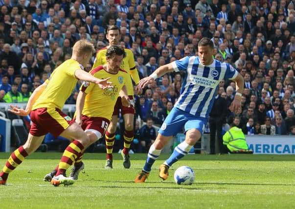 Joey Barton chases down Albion's Tomer Hemed on Saturday. Picture by Angela Brinkhurst