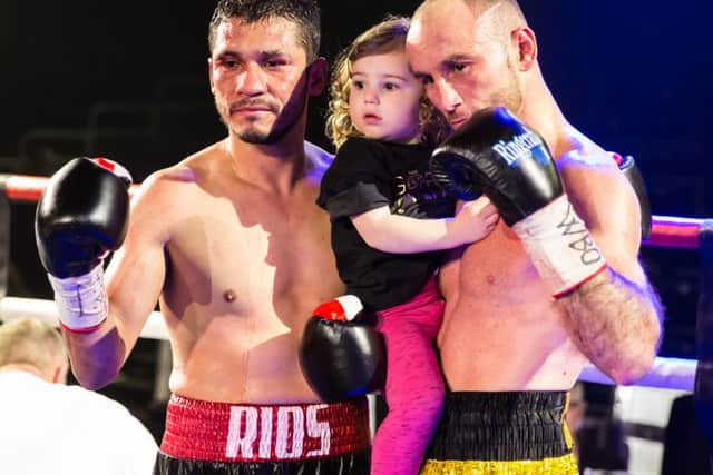Rios shows great sportsmanship by posing with Jones and his daughter for photos, 9th April 2016. (c) Jack Beard SUS-160904-231758008