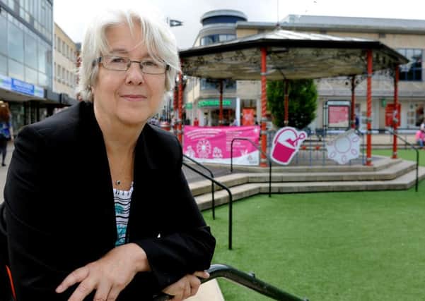 Brenda Burgess with the Queens Square bandstand in the background
