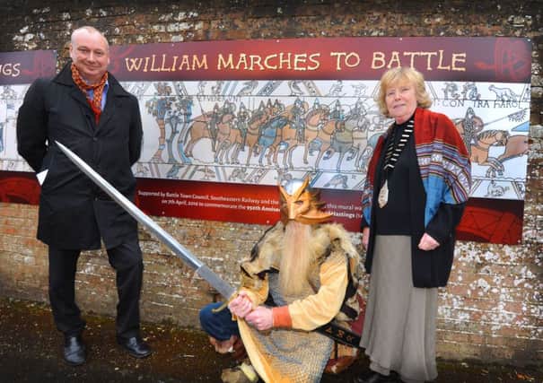 Launch of the Bayeux Tapestry Mural at Battle Station.
L-R David Statham, MD Southeastern Railway; Bob Wait, Battel Bonfire Boyes, and mayor of Battle Margaret Kiloh. SUS-160704-121637001