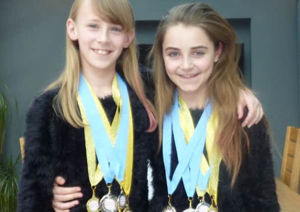 Molly Sloggett, left, and Olivia Flint won a host of medals at the Sussex Festival of Performing Arts in Crawley and Hove