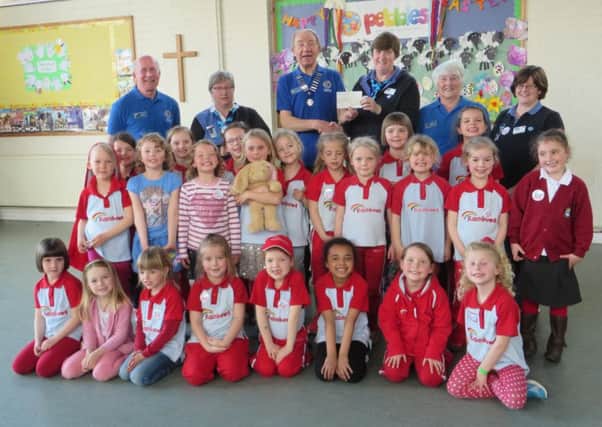 'Adur East Lions Club were very pleased to be able to support the 2nd and 3rd Shoreham Rainbows groups by donating the funds to enable them to purchase flags so that they can take part in parades such as the Remembrance Day Parade.