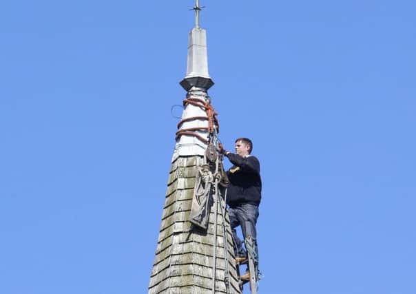 Steeplejack in action at St Andrews Church, Tarring. Photo by Eddie Mitchell.