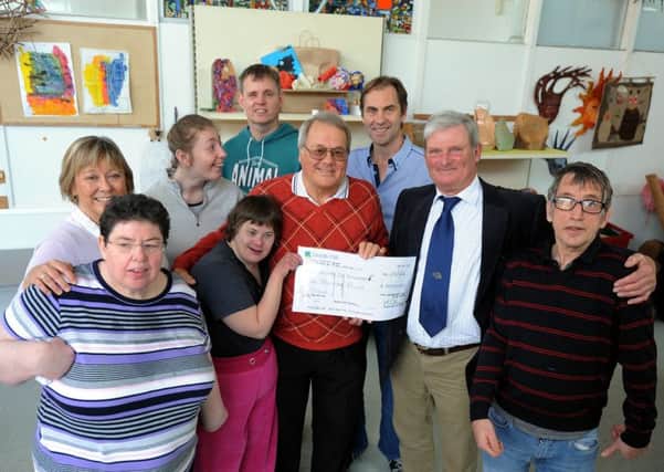 Cheque presentation to the Wrenford Centre, front left to right, Jackie Hennessy, Tania Symonds, John Symonds, Chichester Golf Club captain David Bamber,  and Mark Talmage, back left to right, Wrenford Centre manager Deborah Allsop, Kerry Boxall, Paul Howard and community connector Leo May. Picture: Kate Shemilt ks16000561-1