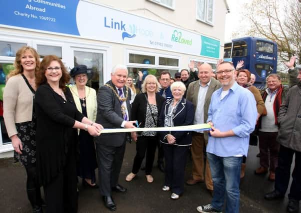 DM16111323a Worthing mayor Michael Donin opens the new chartity shop in Ferring, bringing together Link to Hope and Reloved in one premises