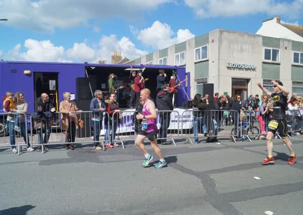 Shoreham Allstars entertain the runners and spectators at the Brighton Marathon on Sunday