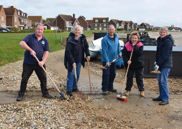 Selsey residents clearing the stones