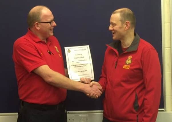 Horsham community first responder Andrew Clark awarded by team leader Marc Harrold for attending his 1,000th call