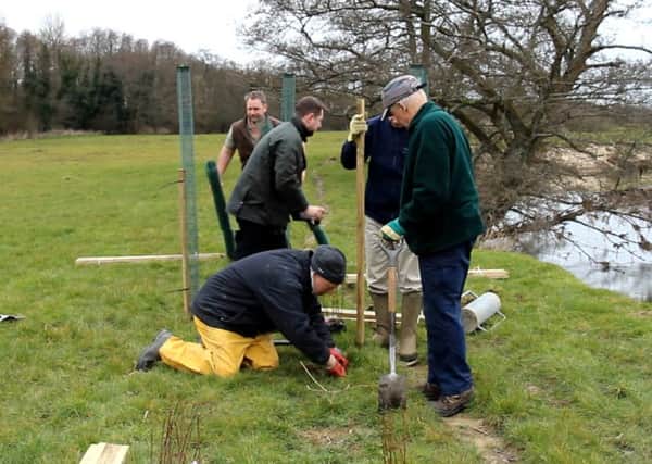 Tree planting by rivers trust volunteers at Coates Castle