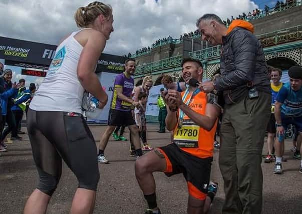 Runner Ben Klinkenbergh proposes to his girlfriend Hannah Jennings at the end of the Brighton Marathon SUS-160418-134215001