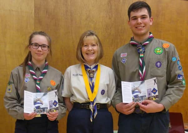 Ania Jasko and Sam Lashwood of Drake Explorer Scouts in Ifield holding the Queens Scout badges with Irene Orford the County Commissioner for West Sussex - picture submitted by the Scouts