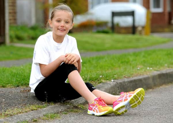 Katie Foss, 8, has wowed Tilgate Parkrun runners by being the fastest female to run 5km. She has done several triathlons and events for charity too. Pic Steve Robards SR1611181 SUS-160419-133559001